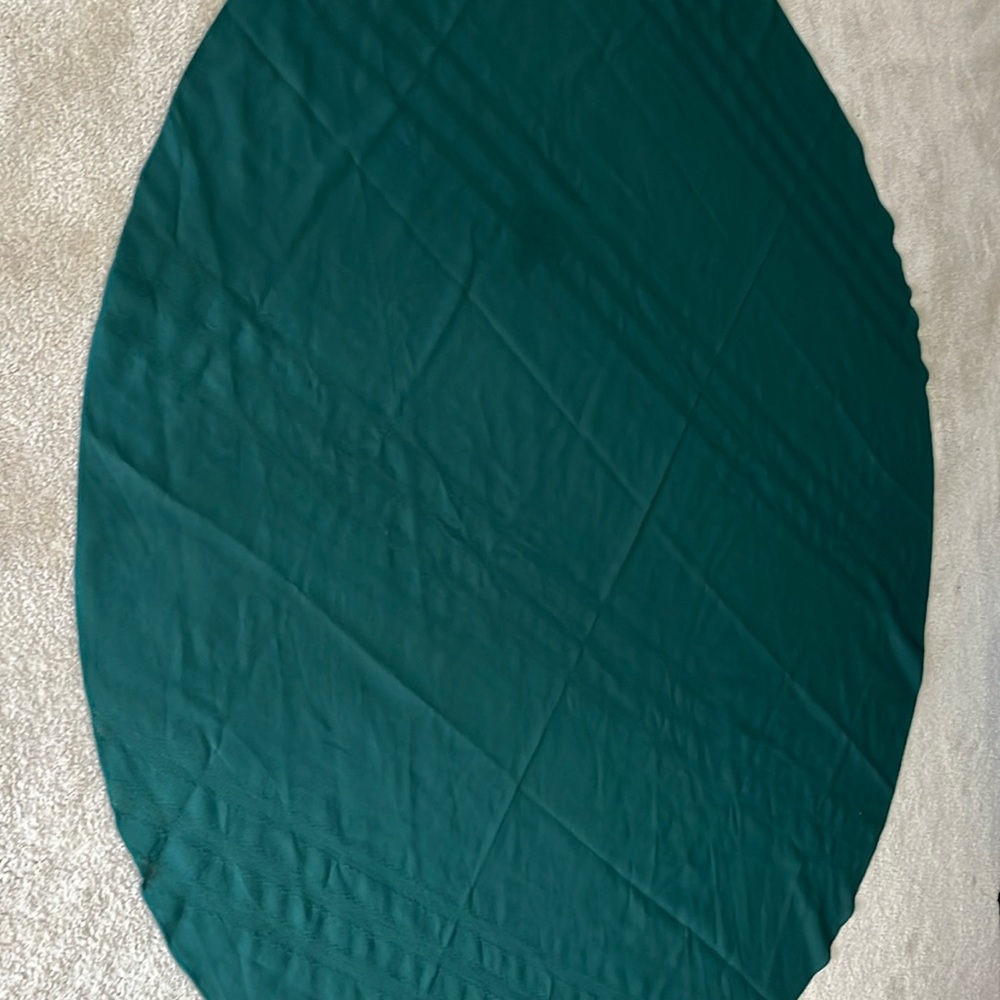 Vintage green 69 inch round tablecloth with small spot